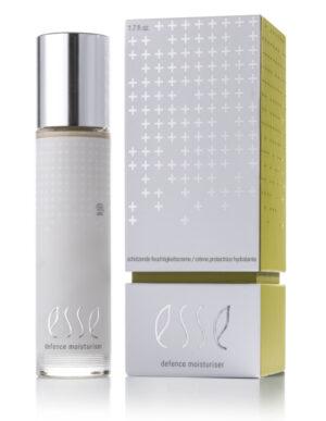 A bottle of Defence Moisturiser with a metallic cap stands beside its sleek silver and green box, both featuring minimalist design elements, white cross patterns, and modern branding.