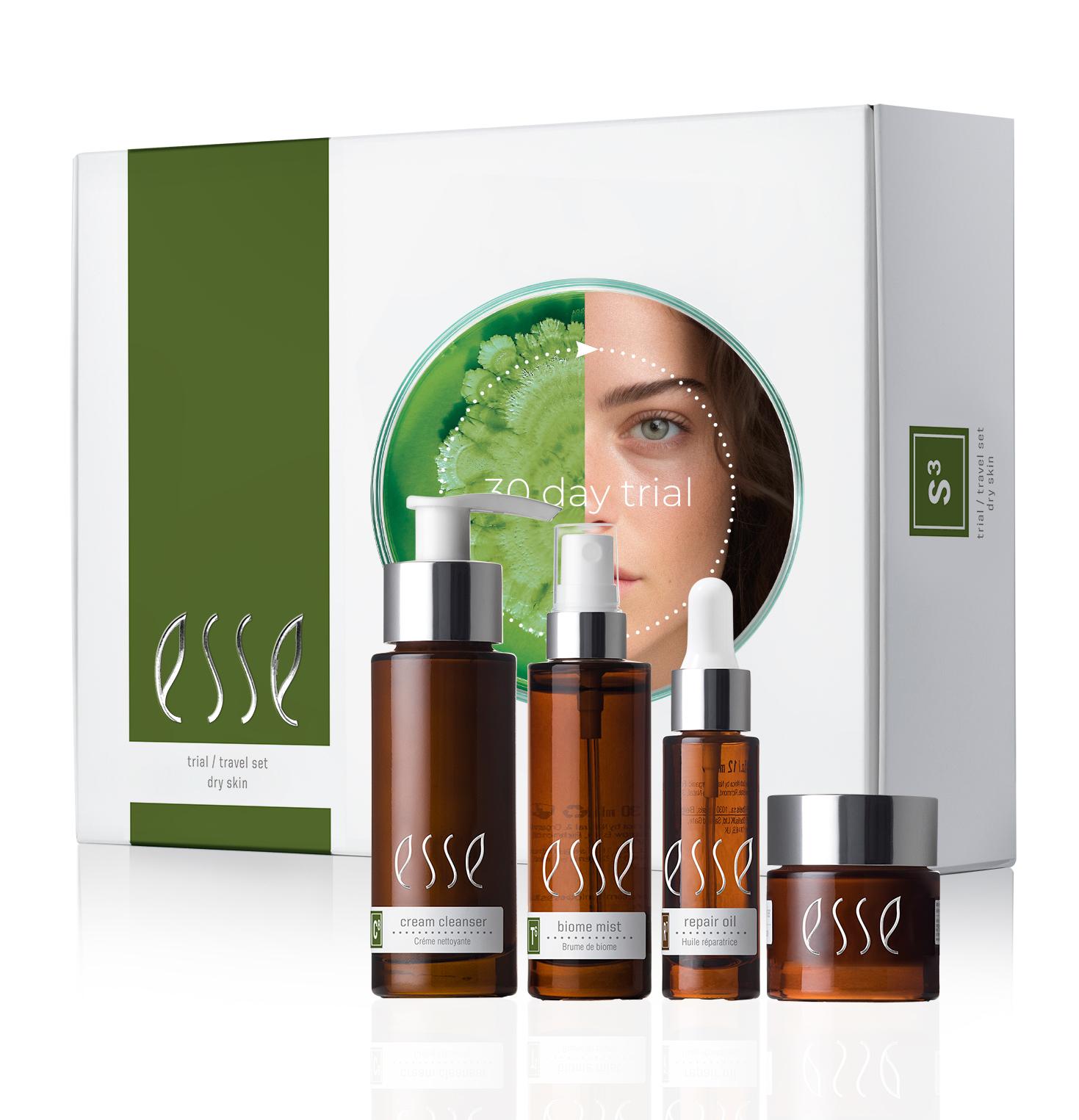 The Sensitive Skin Trial / Travel Set by Esse includes four brown bottles and jars with white labels, displayed in front of a white box featuring the brand name and an image of a partial face with greenery.