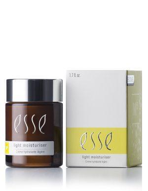 A brown glass jar of Light Moisturiser with a black lid sits beside its white box, both labeled "Light Moisturiser" with yellow accents. The box indicates a volume of 1.7 fl. oz.