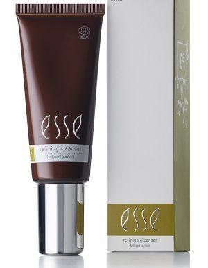 A brown tube of Esse Refining Cleanser (3.4 fl. oz.) with a silver cap is displayed beside its white and gold box, labeled “Refining Cleanser” and “Nettoyant Purifiant.”.