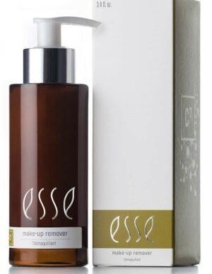 A brown bottle with a silver pump labeled "Make-up Remover" stands next to its matching white and gold box, both featuring the product name.